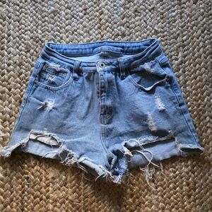 Flirty High Waisted Light Blue Distressed Jean Shorts